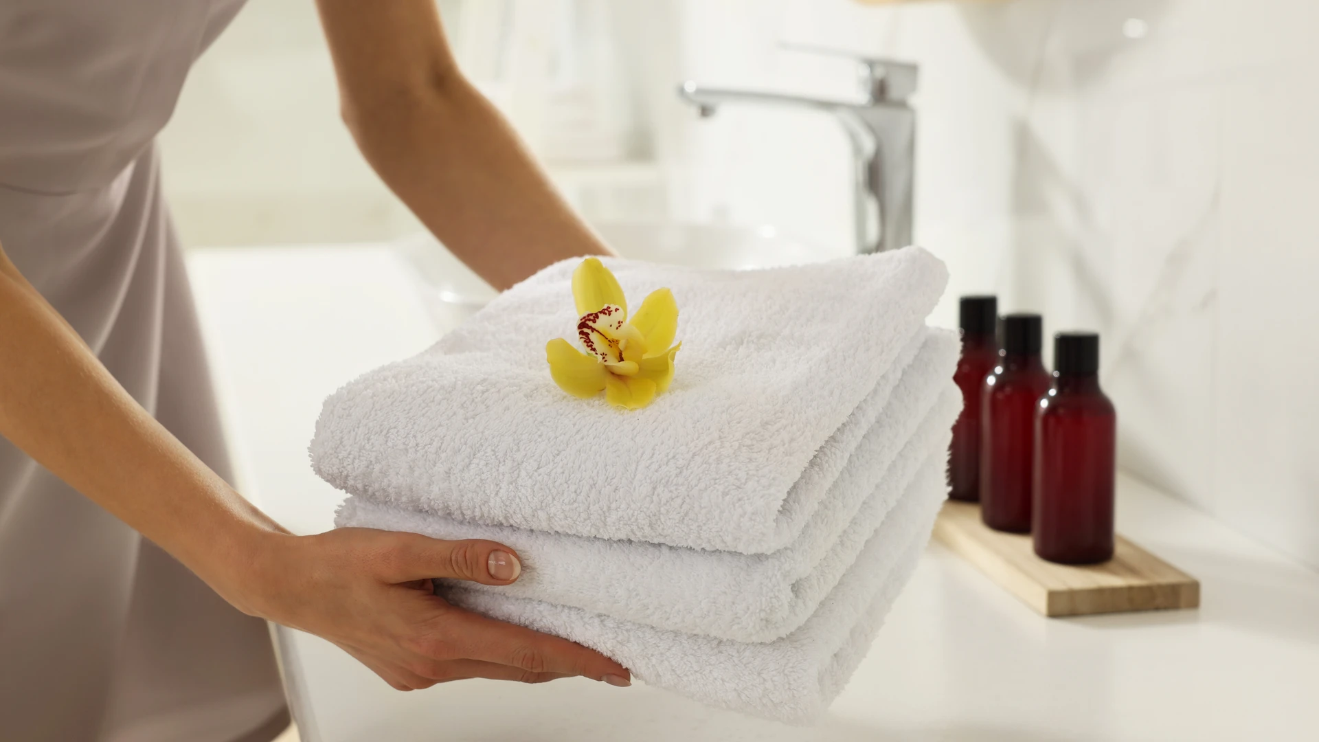 Housekeeper tidying up a luxurious chalet interior