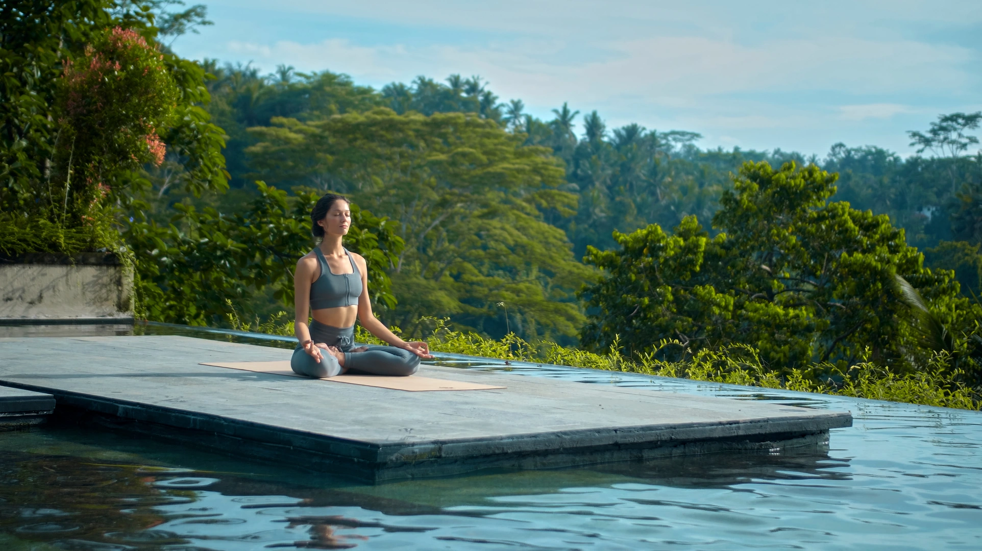 A woman doing a yoga session in a chalet with mountain views