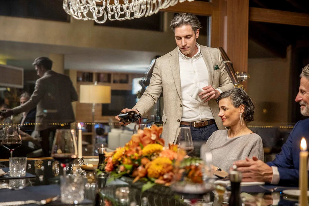 A chef presenting a delicious dish, highlighting the quality and presentation of the food provided.